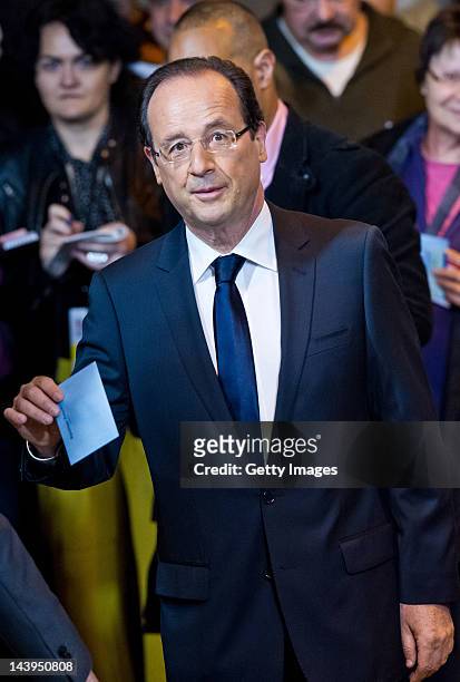 Socialist Party candidate Francois Hollande casts his vote at a polling station during the second round of voting on May 6, 2012 in Tulle, France....