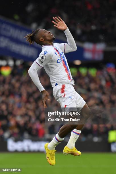 Wilfried Zaha of Crystal Palace celebrates after scoring their team's first goal during the Premier League match between West Ham United and Crystal...