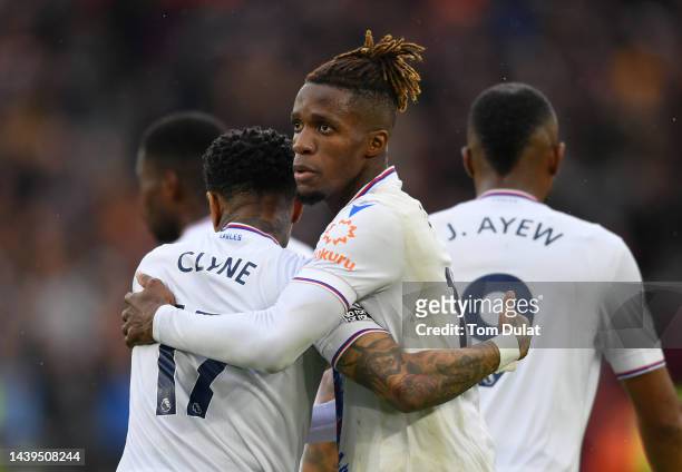 Wilfried Zaha celebrates with Nathaniel Clyne of Crystal Palace after scoring their team's first goal during the Premier League match between West...