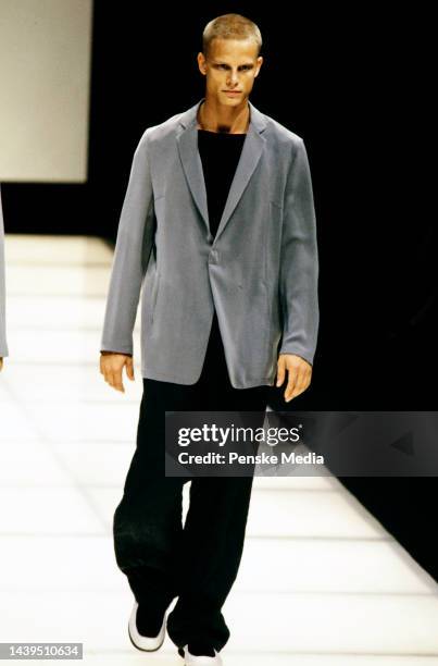 Combined Armani men's fashion show featuring three different brands - Giorgio Armani, Emporio Armani, and Armani Jeans.