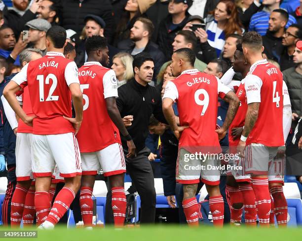 Mikel Arteta the Arsenal Manager talks to his players during a break in play during the Premier League match between Chelsea FC and Arsenal FC at...