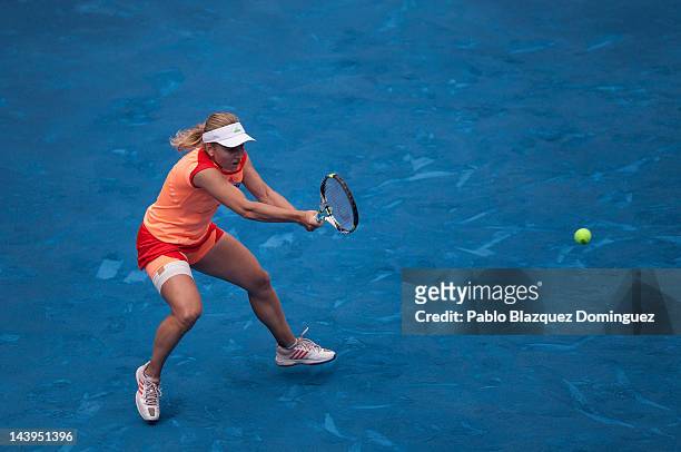 Tennis player Ksenia Pervak of Kazakhstan returns the ball to Caroline Wozniacki of Denmark during the second day of the WTA Mutua Madrilena Madrid...
