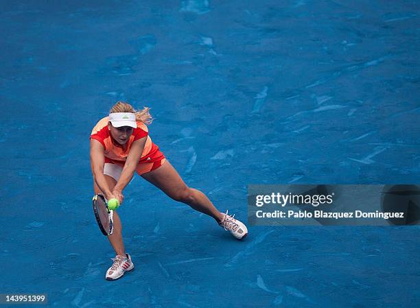 Tennis player Ksenia Pervak of Kazakhstan returns the ball to Caroline Wozniacki of Denmark during the second day of the WTA Mutua Madrilena Madrid...