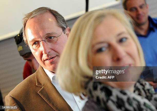 Main candidate for Schleswig-Holstein's Christian Democrats , Jost de Jager casts his vote with his wife Britta at a polling station in the northern...