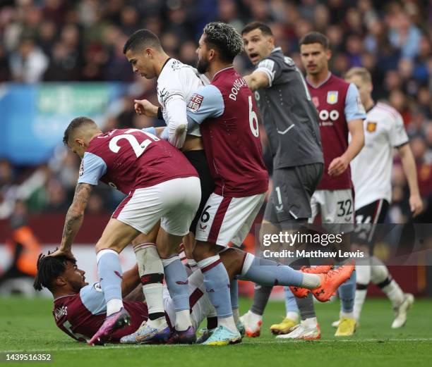 Cristiano Ronaldo of Manchester United clashes with Tyrone Mings of Aston Villa during the Premier League match between Aston Villa and Manchester...