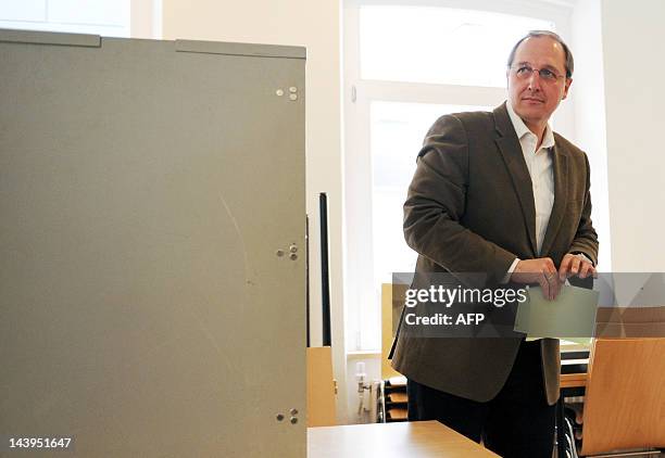 Main candidate for Schleswig-Holstein's Christian Democrats , Jost de Jager casts his vote at a polling station in the northern German town of...