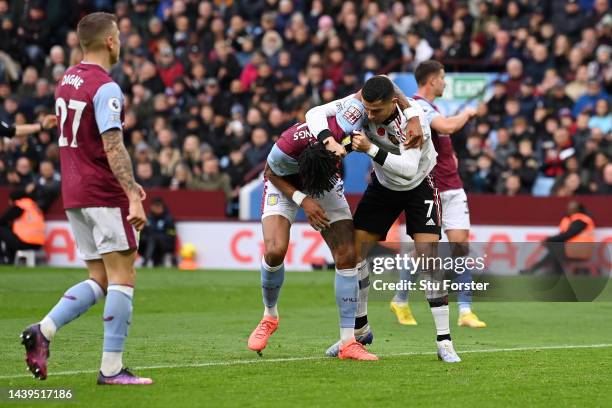 Cristiano Ronaldo of Manchester United clashes with Tyrone Mings of Aston Villa during the Premier League match between Aston Villa and Manchester...
