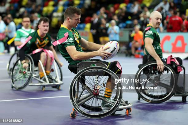 James Hill of Australia goes over for a try during the Wheelchair Rugby League World Cup Group A match between Australia and Ireland at Copper Box...