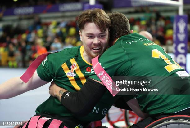 Liam Luff of Australia celebrates their sides try with team mates during the Wheelchair Rugby League World Cup Group A match between Australia and...