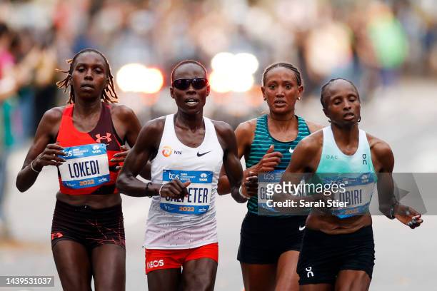 Sharon Lokedi of Kenya, Lonah Chemtal Salpeter of Israel, Gotytom Gebreslase of Ethiopia, and Hellen Obiri of Kenya compete in the Women's...