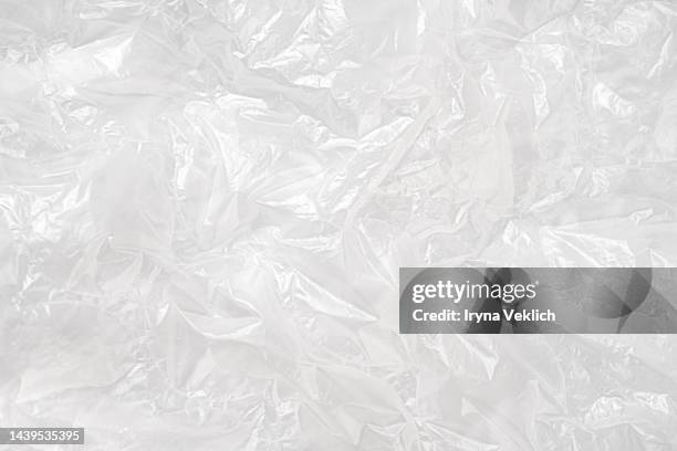 white cellophane background. - plastikfolie stock-fotos und bilder