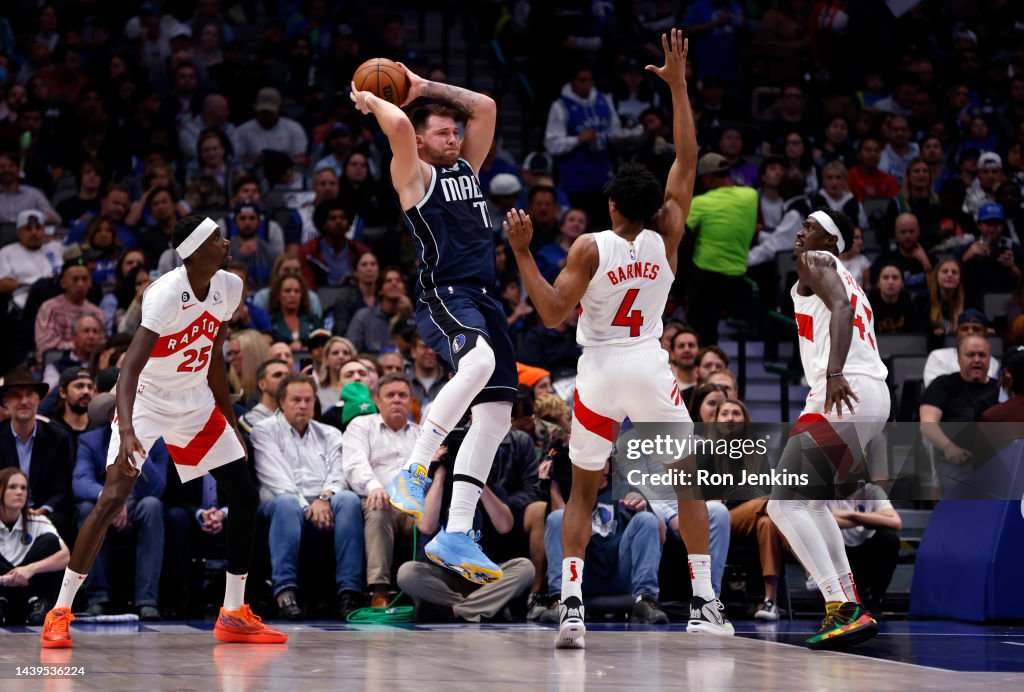 Dallas Raptors Luka Doncic of the Dallas Mavericks passes the ball against the... News ...