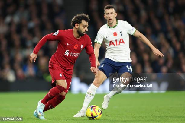 Mohamed Salah of Liverpool is challenged by Ivan Perisic of Tottenham Hotspur during the Premier League match between Tottenham Hotspur and Liverpool...