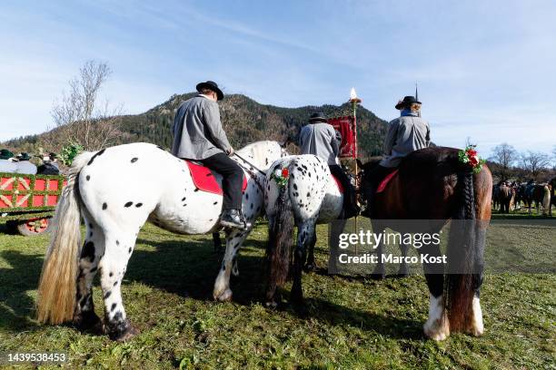 Men and women riding horses participate at the annual Leonhardi procession along Schliersee lake on November 6, 2022 near Miesbach, Germany. The...