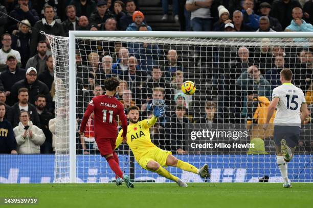 Mohamed Salah of Liverpool scores their team's second goal past Hugo Lloris of Tottenham Hotspur during the Premier League match between Tottenham...