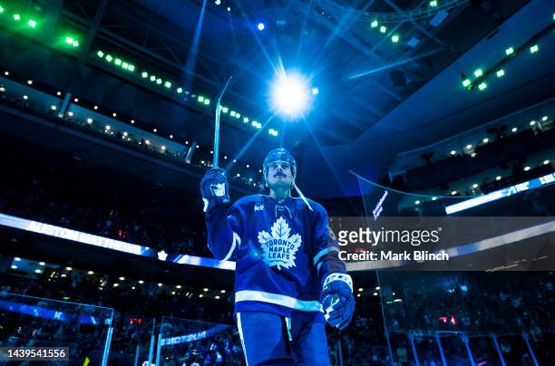 Auston Matthews of the Toronto Maple Leafs salutes the crowd during the three stars presentation after defeating the Boston Bruins at the Scotiabank...