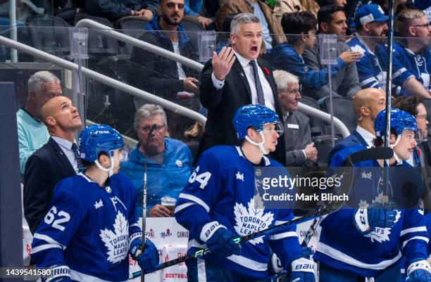 Sheldon Keefe head coach of the Toronto Maple Leafs directs his team from the bench against the Boston Bruins during the second period at the...