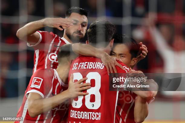 Jeong Woo-Yeong of SC Freiburg celebrates scoring their side's first goal with teammates during the Bundesliga match between Sport-Club Freiburg and...