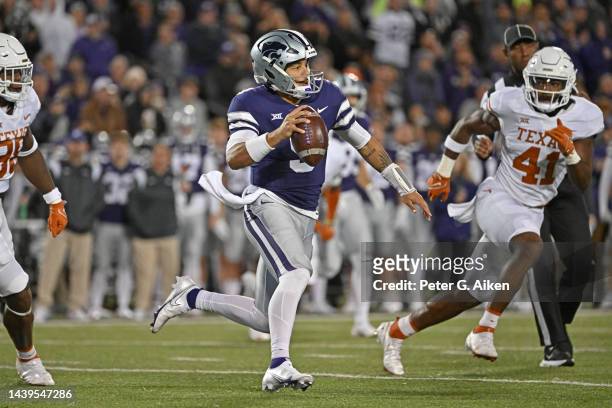Quarterback Adrian Martinez of the Kansas State Wildcats runs with the ball against the Texas Longhorns during the first half at Bill Snyder Family...
