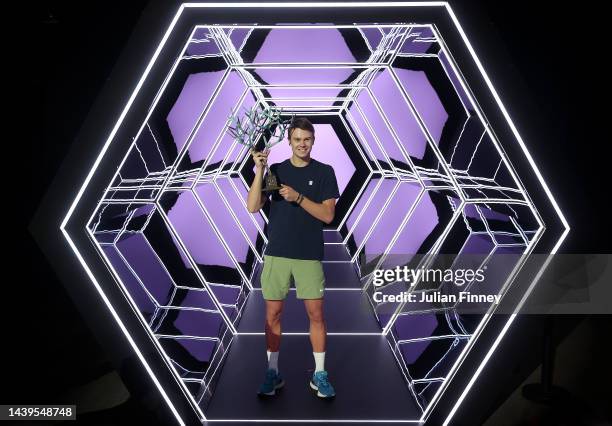 Holger Rune or Denmark celebrates with the winners trophy after defeating Novak Djokovic of Serbia in the final during Day Seven of the Rolex Paris...