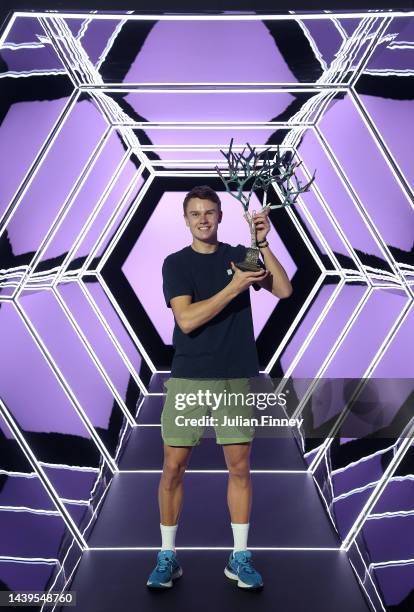Holger Rune or Denmark celebrates with the winners trophy after defeating Novak Djokovic of Serbia in the final during Day Seven of the Rolex Paris...