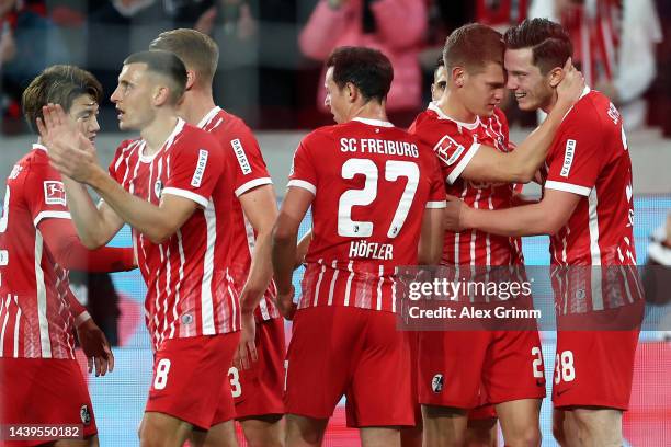 Michael Gregoritsch of SC Freiburg celebrates scoring their side's second goal with teammates during the Bundesliga match between Sport-Club Freiburg...