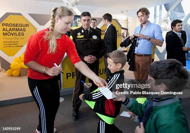 Tennis player Angelique Kerber of Germany signs autographs at the Prosegur stand during the second day of the WTA Mutua Madrilena Madrid Open Tennis...