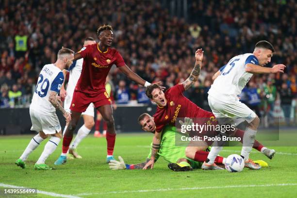 Nicolo Zaniolo of AS Roma is challenged by Ivan Provedel of SS Lazio as Nicolo Casale recovers the loose ball during the Serie A match between AS...