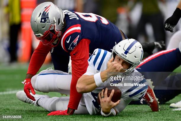 Matthew Judon of the New England Patriots sacks Sam Ehlinger of the Indianapolis Colts in the first quarter at Gillette Stadium on November 06, 2022...