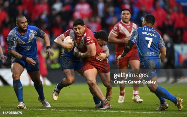 Jason Taumalolo of Tonga is tackled by Jaydn Su'a of Samoa during Rugby League World Cup Quarter Final match between Tonga and Samoa at The Halliwell...