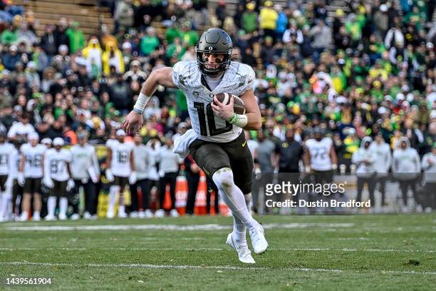 Quarterback Bo Nix of the Oregon Ducks carries the ball for a fourth quarter touchdown against the Colorado Buffaloes at Folsom Field on November 5,...