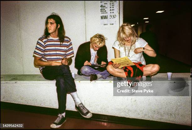 American rock group Nirvana, backstage Belfast left to right bassist Krist Novoselic, guitarist/singer Kurt Cobain and his Cobain's wife singer...