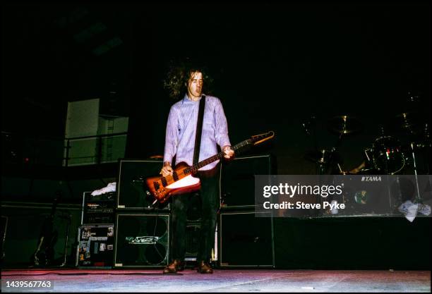 Krist Novoselic bass guitarist in rock group Nirvana performing onstage Belfast 1992