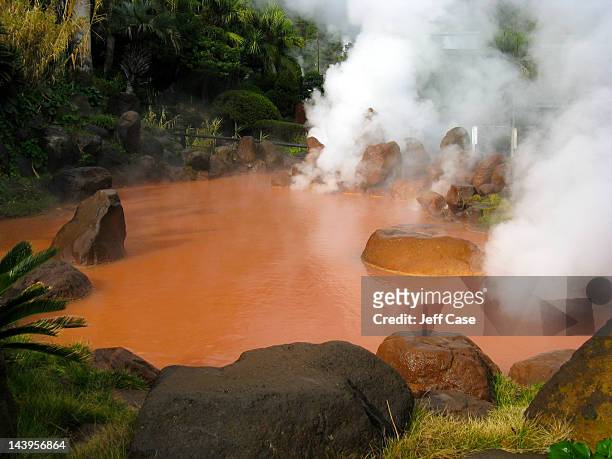 red pool of steaming water - beppu bildbanksfoton och bilder