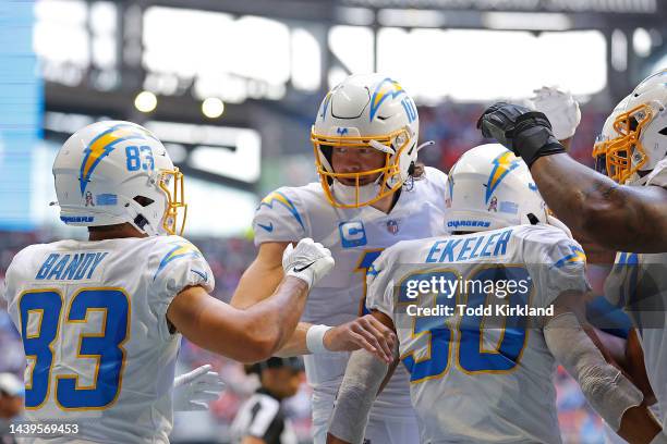 Austin Ekeler of the Los Angeles Chargers celebrates his touchdown with Justin Herbert during the second quarter in the game against the Atlanta...