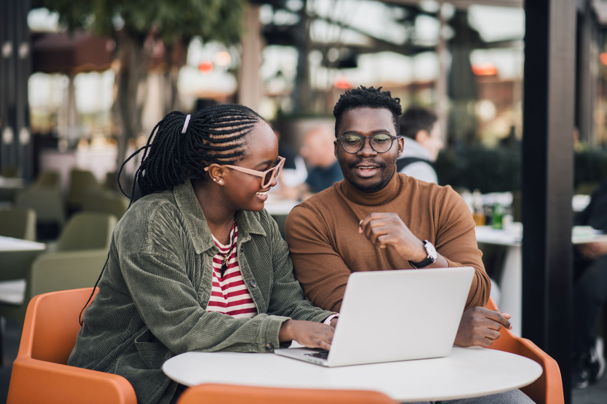 Young black coworkers working from a restaurant Young black coworkers working from a restaurant