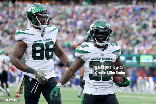 Michael Carter of the New York Jets celebrates a rushing touchdown in the first half of a game against the Buffalo Bills at MetLife Stadium on...
