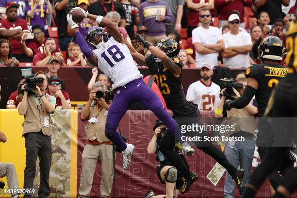Justin Jefferson of the Minnesota Vikings catches a pass for a touchdown in the first quarter of the game against the Washington Commanders at...
