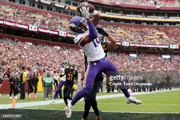 Justin Jefferson of the Minnesota Vikings catches a pass for a touchdown in the first quarter of the game against the Washington Commanders at...