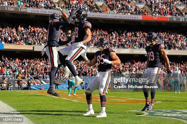 Darnell Mooney of the Chicago Bears celebrates his touchdown against the Miami Dolphins with teammates during the second quarter at Soldier Field on...