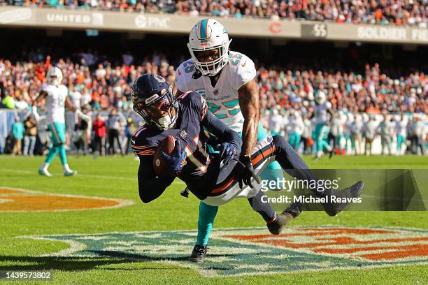 Darnell Mooney of the Chicago Bears catches a touchdown pass defended by Xavien Howard of the Miami Dolphins during the first half at Soldier Field...