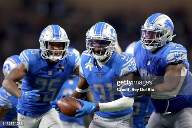 Kerby Joseph of the Detroit Lions celebrates a interception in the third quarter of a game against the Green Bay Packers at Ford Field on November...