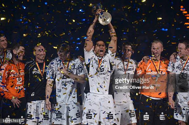 Daniel Narcisse of THW Kiel celebrate with the trophy after winning the Lufthansa Final 4 match between THW Kiel and SG Flensburg - Handewitt at the...