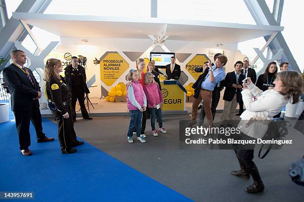 Tennis player Angelique Kerber of Germany takes pictures with fans at the Prosegur stand during the second day of the WTA Mutua Madrilena Madrid Open...