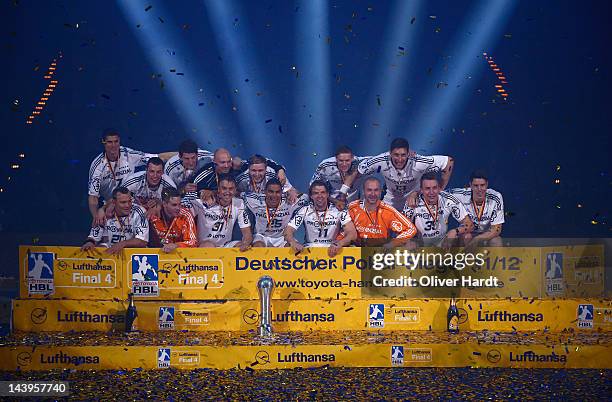 Players of THW Kiel celebrate with the trophy after winning the Lufthansa Final 4 match between THW Kiel and SG Flensburg - Handewitt at the O2 Arena...