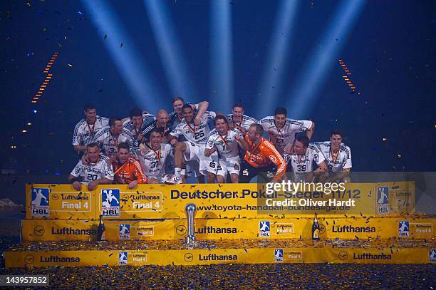 Players of THW Kiel celebrate with the trophy after winning the Lufthansa Final 4 match between THW Kiel and SG Flensburg - Handewitt at the O2 Arena...