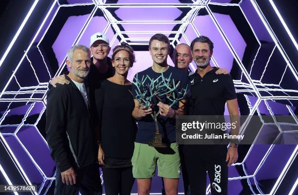 Holger Rune or Denmark celebrates with his mother and with his coach Patrick Mouratoglou after defeating Novak Djokovic of Serbia in the final during...