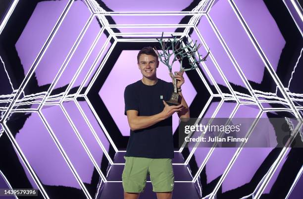 Holger Rune or Denmark celebrates with the winners trophy after defeating Novak Djokovic of Serbia in the final during Day Seven of the Rolex Paris...