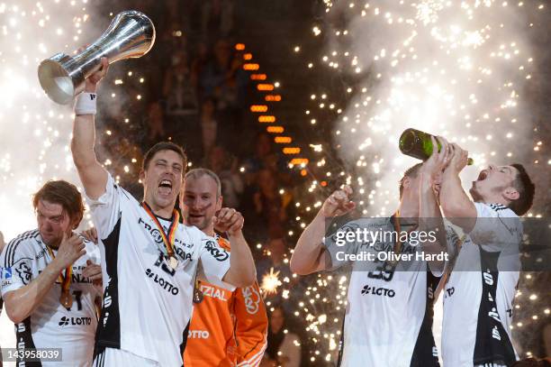 Marcus Ahlm of THW Kiel celebrates with the trophy after winning the Lufthansa Final 4 match between THW Kiel and SG Flensburg - Handewitt at the O2...