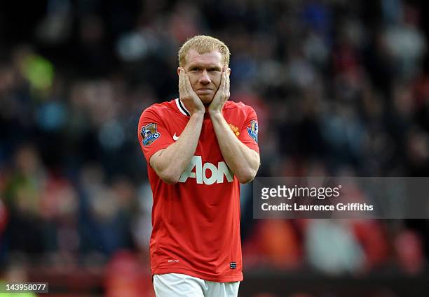 Paul Scholes of Manchester United looks dejected at the end of the Barclays Premier League match between Manchester United and Swansea City at Old...